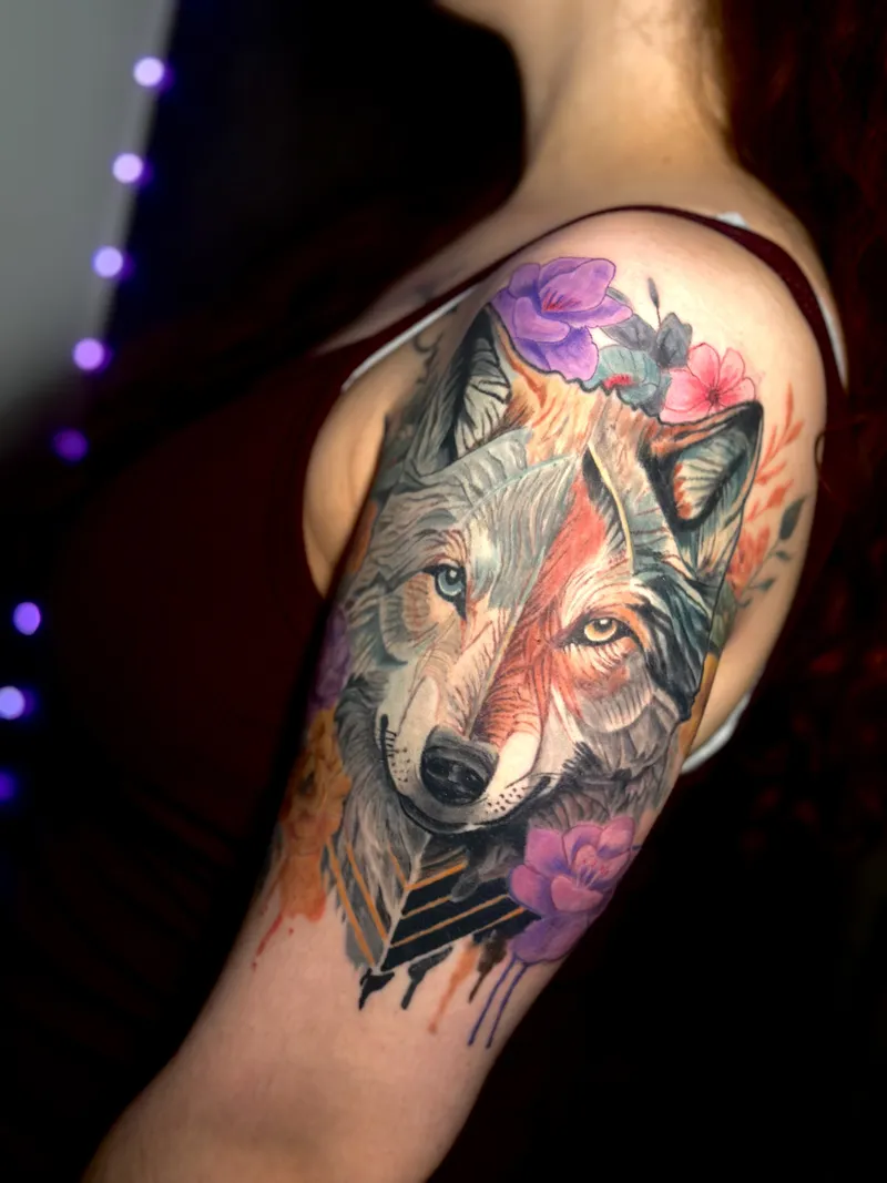Watercolor wolf tattoo with purple flowers and arrows on the shoulder, by Nataly Fierro